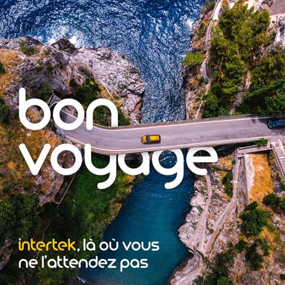 Aerial view of car crossing a bridge between islands